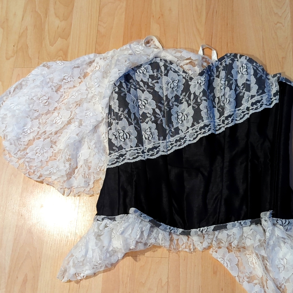 Black steel boned corset with white off the shoulder lace sleeve